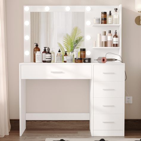 PRICES MAY VARY. Plenty of Storage Capacity: Too many cosmetics? Is your desktop too cluttered? This beautiful makeup table has a wider desktop and 5 larger drawers, your cosmetics, jewelry, hair accessories, and other beauty supplies will easy to find their place. The vanity desk will not only make your room look neat and elegant but also will let you in a beautiful mood. Stable: Our vanity with rectangular mirror is crafted from EPA-grade Particleboard, ensuring their durability and longevity. Makeup Desk With Drawers, Vanity Ideas Bedroom Storage, Makeup Desk Vanity, Make Up Desk Idea, Ikea Desk Vanity Ideas, Cozy Vanity Ideas, White Vanity Gold Hardware, Vanity And Desk Combo, White Vanity Bedroom