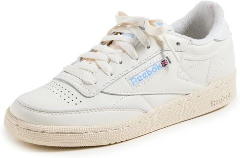 Women's Sneakers with Signature Style: These women's fashion sneakers feature a soft garment leather upper for full-foot support complete with comfortable terry lining on the tongue top and heel; A woven Reebok label adds vintage appeal and style Walking Sneakers For Women, Reebok Club C 85 Vintage, Adidas Gazelle Women, Club C 85 Vintage, Ankle Mobility, Gymnastics Shoes, Club C 85, Vintage Sneakers, Reebok Club C