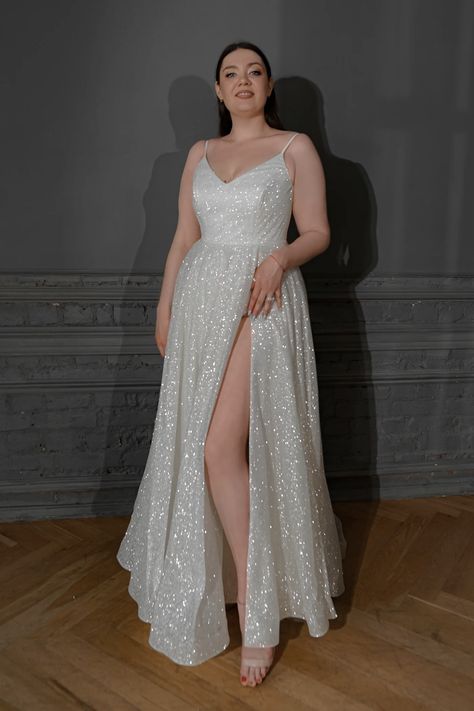 Looking for the dreamiest, princess-like, and utterly unique plus-size wedding dress that won’t break the bank? Well, your search ends right here. Enter the realm of Olivia Bottega – hands down, one of the most stunning bridal brands ever. Sparkly White Dress Plus Size, Hollywood Glam Wedding Dress Sparkle, Plus Size Sparkle Wedding Dress, Plus Size Glitter Dress, Star Themed Wedding Dress, Sparkly Wedding Dress Plus Size, Sparkle Wedding Dress Glitter, Disco Wedding Dress, Glittery Wedding Dresses