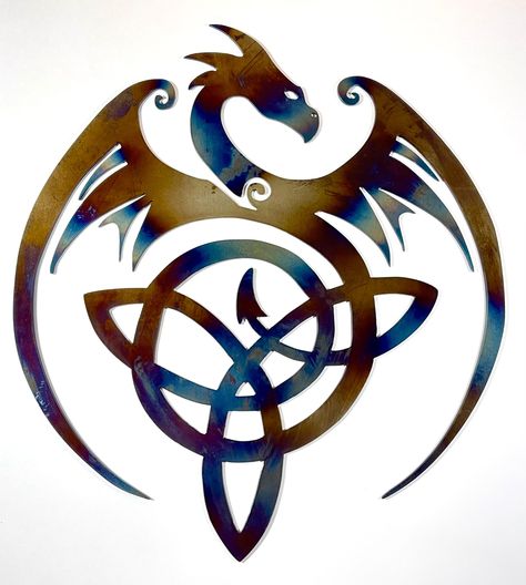 CNC Plasma cut metal wall art: Gorgeous flying dragon with Celtic knot in tail. Cut from 14 gauge mild steel, heat treated to color, with powder coat finish. Measures 14x12 inches. Color may vary due to heat treating process. Great decoration for living room, den, garage, bedroom, or any space. Makes for a unique and stunning gift. Celtic Dragon Drawing, Dragon Celtic, Dragon Silhouette, Alchemy Art, Garage Bedroom, Dragon Tattoo For Women, Flying Dragon, Tree Of Life Art, Decoration For Living Room