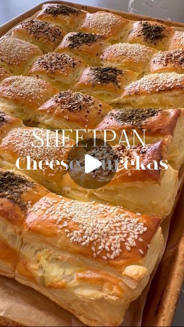 Sivan's Kitchen on Instagram: "Sheet pan cheese burekas, my #1 go to dish for hosting large crowds 🤗 You can find this recipe and many more Hanukkah recipes when you download the FREE E BOOK at @fleishigsmag. USE CODE SIVAN for 18% off newsstand rates and enjoy the app for free !! Fleishigs magazine is way more than kosher food ! Recipe yields 24 burekas pockets Ingredients: •2 puff pastry sheets @jeckysbest 10x15 •1 cup of cottage cheese •1 cup of sour cream •1 cup of grated mozzarella cheese •1 cup of chopped olives (green or kalamata) •2 whole eggs For your topping: •1 beaten egg •za’atar seasoning •sesame seeds •everything but the bagel seasoning Directions: 1.Thaw puff pastry sheets on the counter or overnight in the fridge. 2.Unroll the puff pastry onto a piece o Tictoc Recipes, Sivan's Kitchen, Hanukkah Recipes, Kosher Food, Cheese Puff, Hanukkah Food, Cheese Puff Pastry, Sheet Pans, Bagel Seasoning