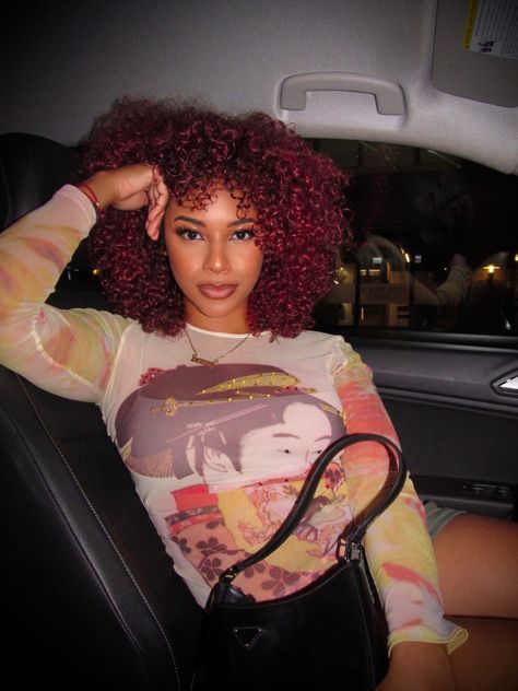 Red curly hair light skin girl in drive seat car posing Cherry Red Curly Hair Black Women, Red Hair Mixed Girl, Red Curly Hair With Bangs, Dark Red Natural Hair, Red Curly Hair Black Women, Bright Red Curly Hair, Afro Hair Red, Cherry Red Curly Hair, Red Curly Hairstyles