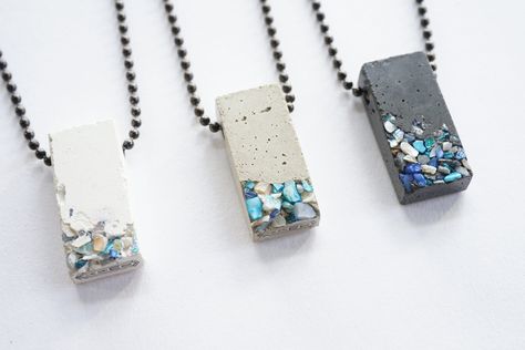 "Available in white concrete, black concrete, or classic grey concrete, this necklace features a cast concrete rectangular block pendant with embedded small blue crushed shells on an 18\", 24\", 26\", or 30 inch gunmetal finish steel ball chain with connector.  This pendant is approximately 1 1/4\"x9/16\"x5/16\"(LWD). These pendants are bold, strong and durable, yet minimal and light, re-imagining concrete into a beautiful, wearable form. All pieces are sealed with a non-toxic waterproof concret Cement Jewelry, Concrete Necklace, Saturn Necklace, Concrete Pendant, Concrete Jewelry, Industrial Jewelry, Peridot Stone, Paper Jewelry, Moon Jewelry