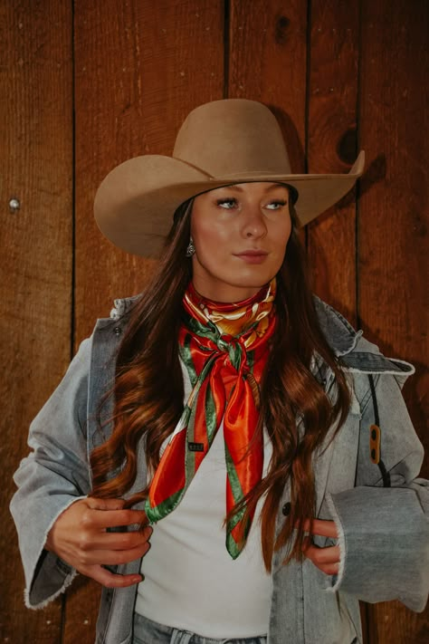 Orange wild rag, approx. 36" x 36." 100% Polyester. Wild Rag Fashion, Cowgirl Outfit With Bandana, Womens Wild Rag Outfits, Ways To Wear Wild Rags, Outfit With Wild Rag, 90s Cowgirl Outfits, Wild Rags Outfits Summer, Orange Cowgirl Outfit, Western Style Fashion