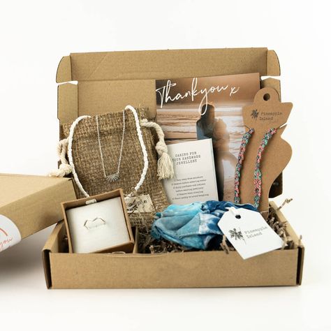 A selection of bestselling accessories for the surfer soul, beautifully wrapped in an eco-friendly letterbox gift set. A handpicked selection of Pineapple Island surf-themed gifts, bound to put a smile on their face, neatly packaged and posted inside a gift box along with a gift card.This letterbox gift set can be sent directly to the recipient by changing the delivery address when you order. You can also add a handwritten gift note with your own personal message inside.(Worth £39) not given Wha Surfer Girl Gifts, Sunset Necklace, Bali Sunset, Girl Gift Baskets, Valentines Gift Box, Gifts For Aunt, Eco Gifts, Wave Ring, Themed Gifts