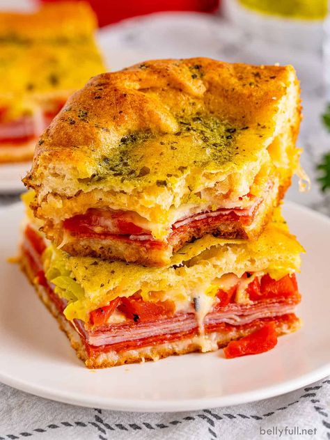 With all of the elements of a baked Italian sub layered with crescent roll dough, these Antipasto Squares make a delicious, easy lunch or fun party appetizer. Italian Sub Squares Delish, Italian Sub Squares, Italian Crescent Casserole, Antipasto Sandwiches, Antipasto Bread, Antipasto Squares, Easy Antipasto, Mimosa Party, Crescent Roll Bake