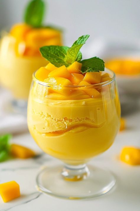 This easy mango mousse will be your new favorite treat! Made with mangoes, honey, and whipped cream, it's a true delight for the palate! Mango Moose Recipes Desserts, Easy Dessert Recipes For Parties, Mango Mousse Cups, Recipes With Mango Puree, Mango Dessert Cups, Easy Mango Desserts, Mango Dessert Recipes Easy, Mango Sherbert, Mango Puree Recipe