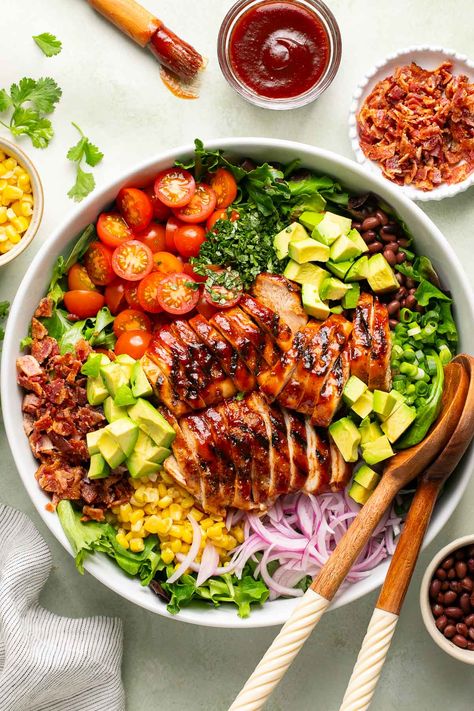 This delicious BBQ chicken salad recipe features grilled BBQ chicken, mixed greens, crispy bacon, juicy tomatoes, corn, onions, avocados, cilantro, and a creamy homemade BBQ ranch. Bbq Chicken Bowl, Bbq Chicken Salad Recipe, Bbq Chicken Breast, Grilled Bbq Chicken, Bbq Chicken Salad, Chicken Plating, Chicken Salad Recipe, Bbq Sauce Homemade, Homemade Bbq