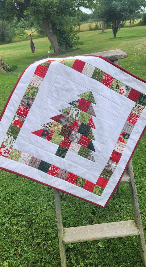 This super cute christmas tree made of Moda fabrics is sure to brighten up any room!  Wallhanging or tabletopper measures 26 square.  Machine pieced, machine quilted and hand bound. Made with 100% cotton Moda Hustle and Bustle Christmas fabric from Basic Grey.  Wonderful gift for you or anyone on your christmas list! Ready to ship! Find Christmas Pattern stock images in HD and millions of other royalty-free stock photos, illustrations and vectors Christmas Quilts Ideas, Christmas Tree Quilt Pattern, Christmas Tree Quilt Block, Quilted Christmas Gifts, Tree Quilt Pattern, Christmas Quilting Projects, Quilted Table Runners Christmas, Little Christmas Tree, Christmas Tree Quilt