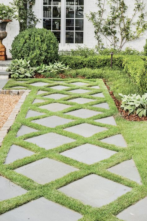 How do you catch the eyes of passersby? Design a welcoming path. Dorlon pulled inspiration for this diamond-patterned one from an existing exterior feature. #landscaping #gardening #southernliving Stone Grass Walkway, Walk Path Landscape, Stones In Grass Walkway, Stepping Stones With Grass In Between, Grass Stone Walkway, Unique Walkways To Front Door, Turf And Pavers Front Yard, Basic Front Yard Landscaping Ideas, Stone And Grass Driveway