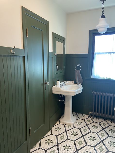 Green wainscoting, hexagon floor, petastal sink Blue Green Wainscotting, Green Wainscoting Kitchen, Green Wainscotting In Bathroom, Modern Bathroom Wainscotting, Green Panel Bathroom, Forest Green Wainscoting, Beadboard Half Wall Green, Dark Green Beadboard Bathroom, High Wainscoting Bathroom