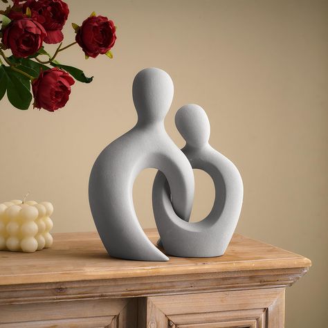 PRICES MAY VARY. 💞 EXUDING ROMANCE: The abstract sculpture is hollowed out and the crossed parts resemble a couple snuggling together, symbolizing wonderful love and companionship, and eternal love to old age. 💞 QUALITY MATERIALS: Made of high quality ceramic carefully fired, the surface is frosted to make it look more unique, it can be wiped clean with a soft cotton cloth, and there is a whole sponge cushion at the bottom, which is smooth to place and will not damage the desktop. 💞 EXQUISITE Ceramics Abstract Sculpture, Modern Clay Sculpture, Abstract Ceramic Sculpture Ideas, Abstract Clay Art, Abstract Clay Sculpture, Abstract Ceramic Sculpture, Couple Bedroom Decor, Bedroom Decor Modern, Love Sculpture