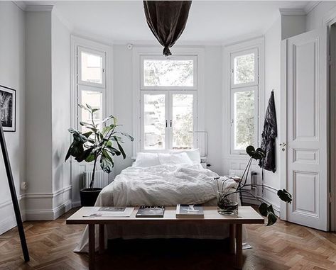 Dream on dreamer . Whats not to love about this stellar bedroom? It has all I could wish for: herringbone parquet wall panels plenty of light and the bed placed in front of the bay window plants and white bedsheets. @temporart totally rocked it! Listing: @husmanhagberg_stockholm Photo: @clearcutfactory #levaochbo