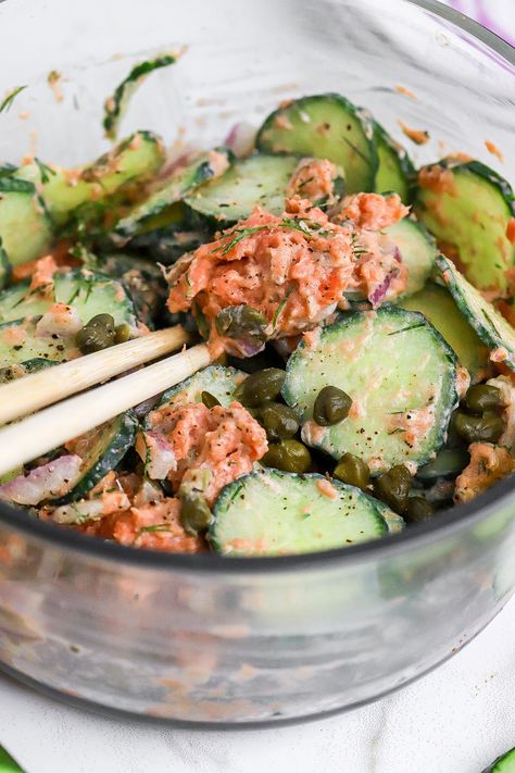 Side view of crisp cucumber salad in a glass container with smoked salmon. Salmon Salad In A Jar, Cucumber And Salmon Salad, Cucumber Salad Smoked Salmon, Cucumber And Tuna Salad, Spicy Tuna Cucumber Salad, Shaken Cucumber Salad, Viral Cucumber Salad With Salmon, Cucumber Salad Salmon, Cucumber Salad With Salmon