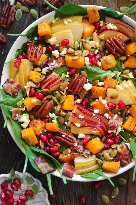 Fall Harvest Salad with Spinach, Butternut Squash, Apple, Pear, Pecans, Pumpkin Seeds, Bacon, Feta Cheese, Pomegranate Arils in a white bowl. Fall Salad With Butternut Squash, Butternut Squash Apple Salad, Julias Album Autumn Salad, Julia’s Album Fall Salad, Julia’s Album Autumn Salad, Apple Salads, Mantle Headboard, Autumn Dishes, Fall Harvest Salad