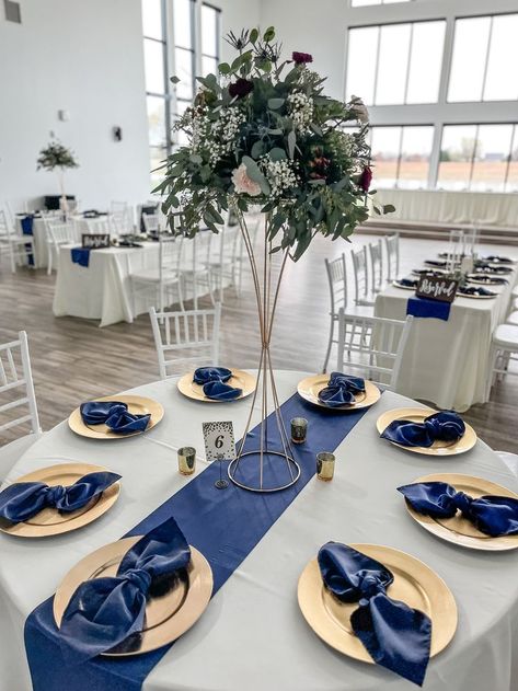 Navy Table Centerpieces, Dark Blue Wedding Centerpieces, Champagne Gold And Blue Wedding, Navy Blue White And Gold Centerpieces, Royal Blue Quince Table Decor, Navy And Silver Wedding Theme, Navy Blue Centerpieces Quinceanera, Navy Blue And Gold Centerpieces, Navy Blue And Burgundy Wedding Reception