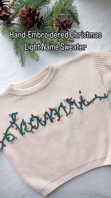 Aspen Lyn Outlet | Hand-Embroidery on Instagram: "Hand-Embroidered Christmas Light Sweater!  I couldn’t wait to share this one! You could totally do this with any of our name kits too I marked out where to put the lights in advance with a water soluble marker to keep them relatively even and the colors well spaced. Just extend the ends of the names on each size and aim for it to finish under the armpit so you can’t see the start and end of the lights!   Who wants to give this a try?  . . . . #diyembroidery #sulky #embroiderykit #beginnerembroidery #embroiderytutorial #embroidery #handembroidery #yarnembroidery #mamaandme #personalizedbabyclothes #babyshower #babyshowergift #newbornoutfit #announcementoutfit #newbabyannouncement #babynamesweater #customsweater #namesweater #embroideredsweat Hand Embroidered Name Sweater, Christmas Sweater Embroidery Ideas, Christmas Embroidered Sweaters, Christmas Embroidery Sweater, Christmas Embroidered Sweater, Embroidered Sweaters, Christmas Tattoo, Custom Sweaters, Personalized Baby Clothes