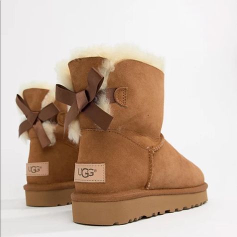 Brand New In Box Ugg Bailey Mini Bow Boots Ii. Size 9. Chestnut Brown Color. Perfect To Give As A Gift With Original Packaging And Box! Backed With A Ribbon Bow, The Bailey Bow Ii Boots From Ugg Are A Playful Take On Their Iconic Silhouette. Shaft Height: 6" Round-Toe Slip-On Boots Bow Detail At Back Water Resistant Suede And Stain Resistant Upper Pieced, Dyed Sheepskin Fur Upper 17 Mm Sheepskin Lining And Insole, And Treadlite Outsole For Comfort Sheepskin Upper; Wool Lining; Polyester Backi Ugg Platform, Platform Outfit, Ugg Boots With Bows, Cute Uggs, Chestnut Brown Color, Brown Ugg Boots, Ugg Ankle Boots, Uggs With Bows, Ugg Bailey Bow