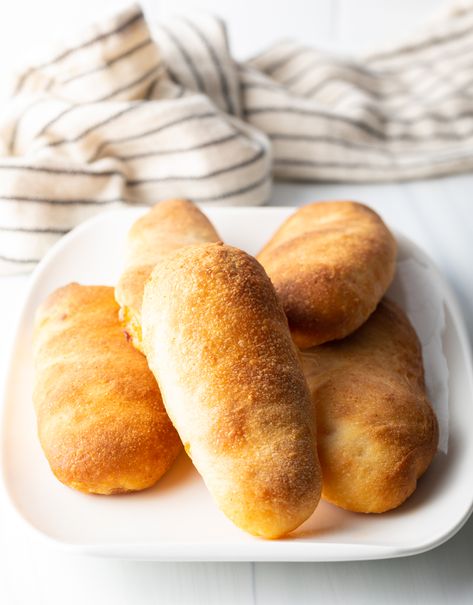 This classic West Virginia Pepperoni Rolls recipe includes flavorful slices of pepperoni and gooey mozzarella cheese, baked inside soft homemade pizza dough. Like a homemade hot pocket but WAY better :) | A Spicy Perspective West Virginia Pizza Rolls, Peperoni Rolls Homemade, Pepperoni Roll Dough Recipe, Sourdough Discard Pepperoni Rolls, Sourdough Pepperoni Rolls, West Virginia Pepperoni Rolls Recipe, West Virginia Pepperoni Rolls, Classic Pizza Dough Recipe, Homemade Pepperoni Rolls