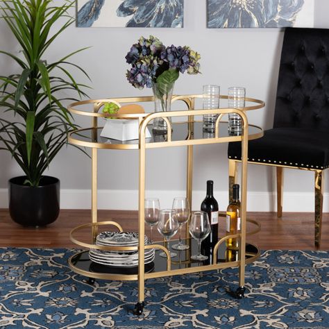 Everly Quinn Olympie Baxton Metal and Tempered Glass 2-Tier Bar Cart | Wayfair Raised Borders, Shaped Shelves, Affordable Dining Room Sets, Wine Cart, Metal Bar Cart, Contemporary Glam, Tempered Glass Shelves, Caster Wheels, Baxton Studio