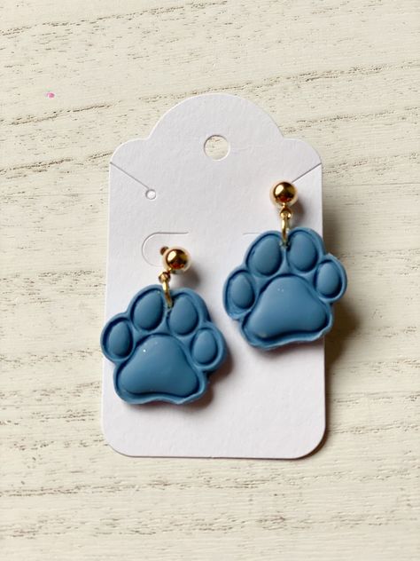 Handmade polymer clay earrings in a paw print shape. Lightweight and hypoallergenic Paw Print Clay Earrings, Wolf Paw, Mom Earrings, Earring Handmade, Custom Earrings, Dog Bone, Blue Glitter, Diy Clay, Handmade Polymer Clay