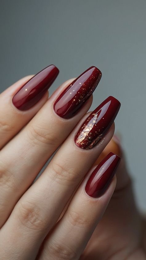 Transform your nails with stunning burgundy designs From dark red to classy black find ideas for art polish French tips and more Discover chic short designs and elegant French tip styles Whether you prefer chrome acrylic or classic polish these burgundy nail designs will elevate your look Cranberry Nails With Gold, Burgundy Nails Winter, Dark Red With Gold Nails, November Red Nails, Dark Red Nails With Gold Design, Dark Red Winter Nails, Deep Red And Gold Nails, Dark Red Design Nails, Nails Burgundy And Black