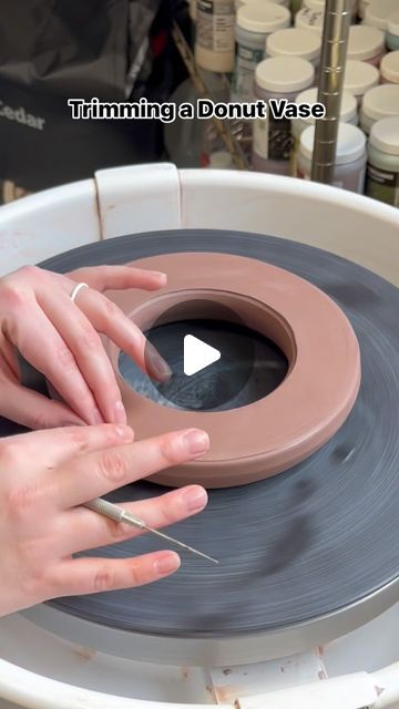 66K views · 1.6K likes | Cheri Downey | Ceramicist on Instagram: "This is trimming a donut vase that was thrown on the wheel! Since it was thrown, it has a flat bottom and needs to be trimmed so that both sides are rounded. Towards the end of the video, I tap it to create a flat side so it can sit nicely. I cut a whole at the top and will attach a neck shortly after! 

#ceramics #pottery #potteryasmr #ceramicart #supportsmallbusiness #giftideas #homedecor #mug #handmadevase #donutvase #donutvasetutorial #madeinaskutt #fired #ceramicvase #potterytrimming #trimmingpottery #wheelthrown #mugshot #brownspeckledclay #speckledclay" Wheel Thrown Vases, Donut Vase Pottery, Thrown Ceramics Ideas, Pottery Wheel Ideas, Ceramic Donut Vase, Donut Vases, Clay Wheel, Donut Vase, Big Vases