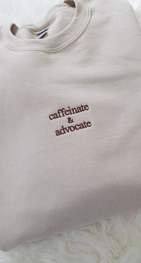 Show off your dedication and passion with our Embroidered Caffeinate And Advocate Awareness Crew. This crewneck sweatshirt is perfect for para professionals, special education teachers, social workers, and anyone who believes in equal rights and social justice. With its bold embroidery and empowering message, this sweatshirt serves as a reminder to stay caffeinated and advocate for important causes. Whether you're in the classroom, the office, or out in the community, this sweatshirt is a stylish way to showcase your commitment to making a difference. It also makes a thoughtful and meaningful gift for the feminist and advocate in your life. Stand up, speak out, and make a statement with this impactful crewneck sweatshirt. Our Gildan sweatshirt is made from a blend of 50% cotton and 50% pol Self Care Shirt Ideas, Embroidered Clothes Ideas, Gifts For Social Workers, Social Worker Outfits, Events Logo, Personalization Ideas, Sport Events, Special Ed Teacher, T Shirt Prints