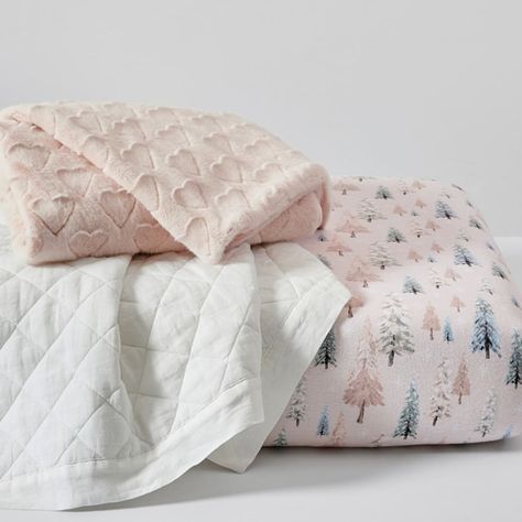 Create a dreamy wonderland with our baby bedding. Printed with snowy pastel trees, the crib fitted sheet offers the wintry warmth of organic cotton flannel. Perfect for year-round strolling and snuggling, our blush-pink Sweetheart baby blanket bundles them in silky faux fur, and the super-soft linen quilt is woven of European flax and diamond-quilted over lightweight fill. DETAILS THAT MATTER Sweetheart Faux Fur Baby Blanket Made of 50% recycled acrylic and 50% virgin acrylic. Reverses to 100% recycled polyester in White. 600-gram weight. Blanket is yarn-dyed - Fiber has incredibly rich color that holds its vibrancy over time. European Linen Toddler Quilt Quilt is made of 100% linen woven from European flax which is constructed in China. Filled with 100% polyester batting; 200-gram weight. Weight Blanket, Crib Fitted Sheet, Baby Bedding Set, Christmas Bedding, Toddler Quilt, Nursery Decor Boy, Baby Bedding Sets