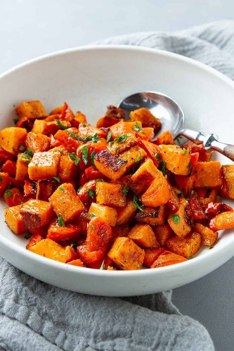 Savor the natural sweetness of roasted sweet potatoes and carrots, balanced with the richness of maple syrup and a medley of savory herbs. | Oven | Vegan | Plant Based Recipes | Vegetarian | Thanksgiving Roasted Sweet Potatoes And Carrots, Sweet Potatoes And Carrots, Baked Cauliflower Casserole, Healthy Thanksgiving Sides, Thanksgiving Side Dishes Healthy, Autumn Side Dishes, Potatoes And Carrots, Thyme Recipes, Vegan Plant Based