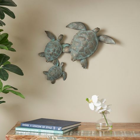 This turtle wall decor can be displayed on a shelf or table to add a touch of maritime charm to your decor. This item ships in 1 carton. Polystone wall decor makes a great gift for any occasion. Turtle Homes, Turtle Wall Decor, Decorative Wall Sculpture, Turtle Sculpture, Turtle Decor, Star Wall Art, Book Sculpture, Nails And Screws, Nautical Style