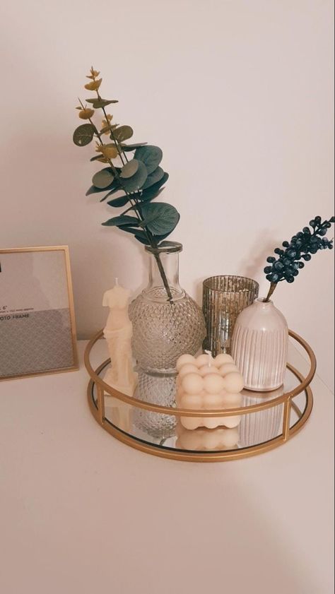 Gold mirrored tray holding 3 vases, two of them containing faux plants, and two unique candles. Deco Studio, Bed Design Modern, Bedroom Deco, Dekorasi Kamar Tidur, Cozy Room Decor, Room Design Bedroom, Decor Home Living Room, Cute Room Decor, Room Ideas Bedroom