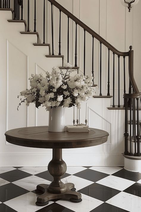 18 Impressive Entryway Decor Ideas For A Foyer That Wows Foyer Ideas Entryway Stairs, Round Foyer Table Decor Entryway, Round Foyer Table Decor, Large Entryway Ideas Foyers, Large Foyer Ideas, Large Entryway Ideas, Foyer Tile Ideas, Classic Entryway, Foyer Table Decor