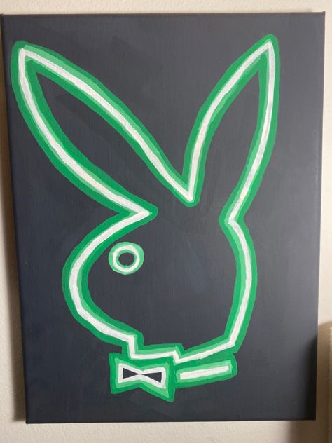 Black painted canvas with a playboy bunny logo in a neon green styled painting. Nein Paintings, Neon Style Painting, Cute Mini Canvas Paintings For Boyfriend, Black Spray Paint Ideas, Y2k Canvas Painting Easy, Neon Painting Ideas On Canvas, Neon Painting Canvas Easy, Neon Drawings Easy, Neon Sign Painting Canvas Diy