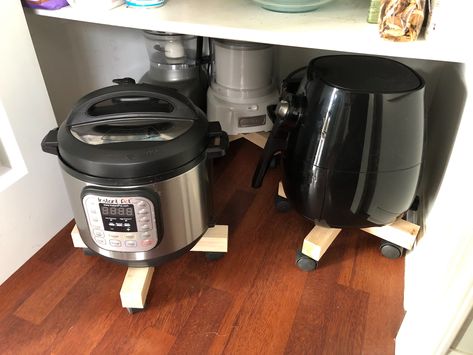 Put small appliances on rolling plant stands.  Tired of not being able to easily access her small appliances, she put them each on a rolling plant stand. This idea works for any large basket or crate that you want to store on the floor of your closet-style pantry. Just add wheels or put the whole thing on a rolling stand! Pantry Organization Small Appliances, Pantry Organization Ideas For Small Appliances, Storing Large Kitchen Appliances Pantry Ideas, Appliance Pantry Storage, Pantry Organization With Appliances, Storing Large Kitchen Appliances, Storing Appliances In Pantry, Pantry Organization Appliances, Large Kitchen Appliance Storage