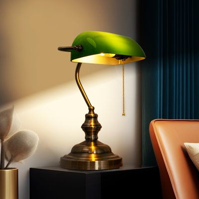 This lamp is similar to the classic look of a traditional mid-century green bank lamp. A green shade with a bronze base combines great lighting with beautiful style. The elegant design is carefully disguised by carefully selected durable materials that make this lamp long-lasting. | House of Hampton® Dontrice Classic Green Banker Desk Lamp w / Pull Chain Switch Plastic / Metal in Green / Yellow | 21.65 H x 7.87 W x 7.87 D in | Wayfair Green Antique Lamp, Green Library Lamp, Bank Lamp, Green Library, Library Lamp, Green Bank, Bankers Desk Lamp, Boho Traditional, Colorado House