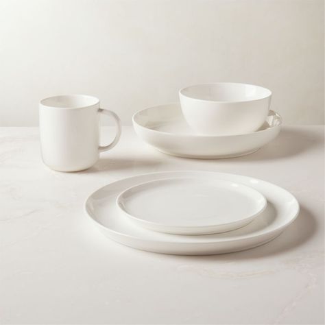 Refined, rimless profiles in handmade new bone china dinner plate set need nothing more than a hi-gloss cream glaze to command attention.HandmadeNew bone China with hi-gloss glazeMicrowave- and dishwasher-safe; oven-safe to 350 degrees for no more than two hoursImported White Pasta Bowls, Dinnerware Set Modern, Grey Dinnerware, Green Dinnerware, White Soup, White Dinnerware Set, White Dish, Apartment Vibes, Bone China Dinnerware