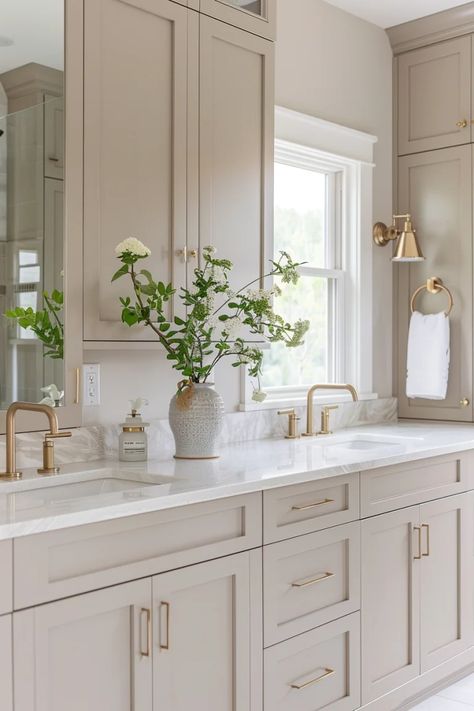 10 Steps to Create a Low Maintenance Bathroom That Saves You Time Bright And Airy Master Bath, Small Bathroom Remodel Neutral Colors, Master Bath Cabinet Color Ideas, White Cabinet Bathroom Ideas Master Bath, Main Level Bathroom Ideas, Cream Cabinet Bathroom, Bathroom Remodel Neutral Color Schemes, Creamy Bathroom Cabinets, Wood Look Bathroom Floor