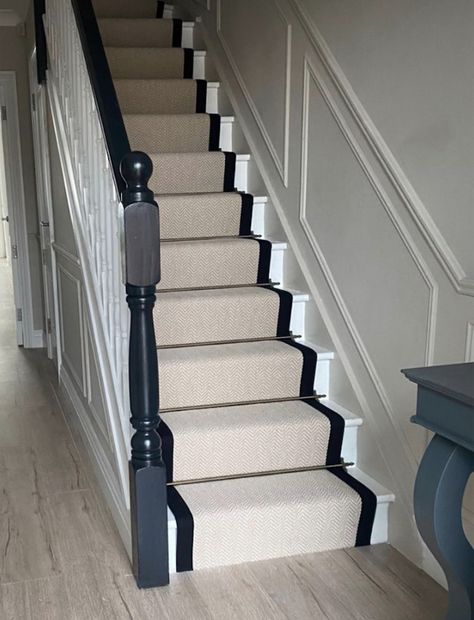 Stair runners are often MUCH cheaper then a full carpet on the staircase and when paired with cast iron rods, add a beautiful Victorian London look! An essential cheap upgrade for upstairs flats! Hallway With Stair Runner, Staircase Entryway Ideas Small, Pine Staircase Makeover, Stair Runner Black Trim, Hallway Bannister Ideas, Black Stairs Runner, Stair Runner Bars, Staircase Makeover With Runner, Black And White Staircase With Runner