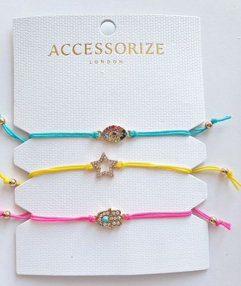 ACCESSORIZE, 3  PACK OF CRYSTAL DRAWSTRING BRACELETS, EYE, STAR & HAMSA HAND 🌸🌻🌺 These summer-inspired bracelets are crafted with crystal charms on colourful cords. Brighten up any dull day with a colourful bracelet! This set includes three drawstring bracelets complete with crystal features Choose from a multi coloured eye on blue cord a crystal star on yellow cord and a crystal Hamsa hand on pink cord. Keep for yourself or share with your besties What's not to love 🌸 Drawstring Bracelets, Colourful Bracelet, Multi Colored Eyes, Inspired Bracelets, Hamsa Bracelet, Crystal Stars, Crystal Charm, Hamsa Hand, Colorful Bracelets