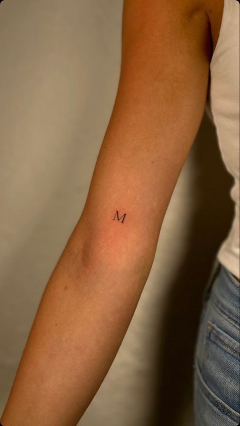 Arm Initial Tattoo, Micro Tattoo Letters, Maeve Tattoo, Letter Arm Tattoo, Initial M Tattoo, M Tattoo Letter Initial, Dainty Letter Tattoo, Cursive Initial Tattoo, Cursive M Tattoo