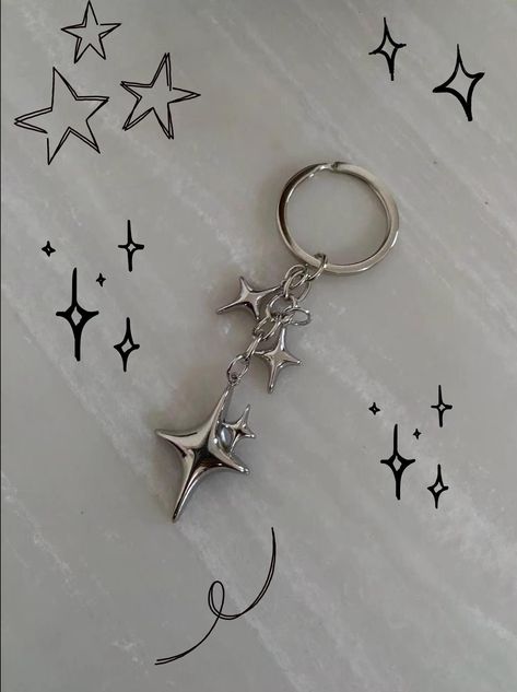 y2k star keychain! Total drop length: 3 IN Carabiner in the last photo is also on my page! Just an example of how to style the keychain :) Shipping 95% chance it will be there in under 14 days I Have a longer shipping time stated for the small chance it is not and there is trouble with the shipping process. If there are any problems I will do all I can to help DM me with any questions! Introducing the Y2K Silver Star Keychain--a delightful blend of nostalgia and elegance. This enchanting keychai Keychain Aesthetic Ideas, Car Keychain Aesthetic, Star Carabiner, Y2k Charms, Cute Keychains For Car Keys, Keychains Aesthetic, Y2k Keychain, Dice Keychain, Cute Key Chains