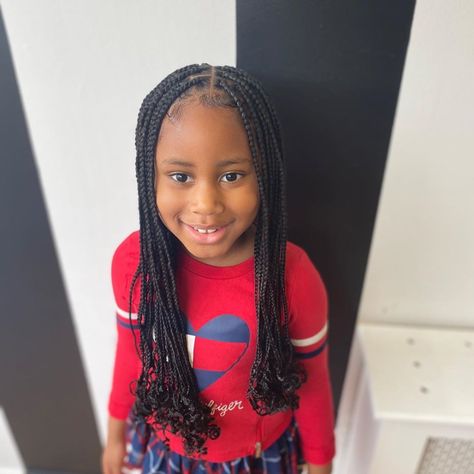 young girl in a red sweater spotting a knotless curly tipped braids Children Knotless Braids, Kids Single Braids, Kids Knotless Box Braids, Kids Knotless Braids, Knotless Braids Kids, Kids Hairstyles Girls Black, Knotless Braids For Kids, Black Braid Styles, Kids Braids With Beads