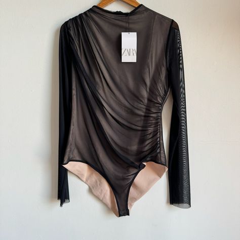 Nwt Zara Draped Mesh Mock-Neck Body Suit Material: 95% Polyester, 5% Elastane. Lining - 85% Polyester, 15% Elastane Size: Xxl Condition: New With Tags - See Photos Details: Black Mesh Body Suit With Light Nude Lining, Long Sleeves, And A Mock-Neck . Black Mesh Has Diagonal Draping And Is Rouched Along The Side Seam. Back Zipper Closure; Snaps Open/Closed At The Crotch. Measurements: Chest: 40" Waist: 35" Hip: 44" Shoulder To Shoulder: 15.5" Sleeve Length: 29" - All Un-Stretched Suit Material, Body Suit, Zara Black, Black Mesh, Zara Tops, Mock Neck, Zara, Sleeve Length, Mesh