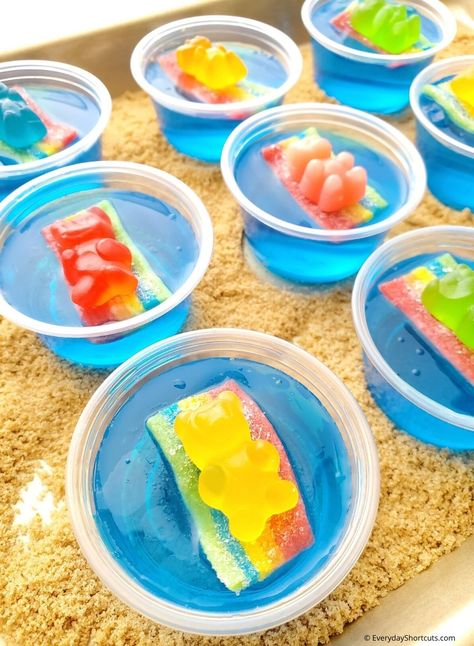 Beach Party Jello Shots - Everyday Shortcuts Tiki Jello Shots, Gummy Bear Jello Shots, Pool Jello Shots, Shotcuterie Board, Beach Jello Shots, Pool Party Jello Shots, Shark Jello, Fun Jello Shots, Party Jello Shots