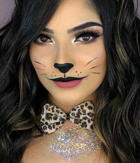 "Get ready to turn heads this Halloween with a fierce and stylish leopard costume! This wild and glamorous look is easy to create with a leopard print bodysuit, dress, or jumpsuit. Add cat ears, a tail, and leopard-inspired face makeup with bold eyeliner, whiskers, and spots to complete your transformation. Perfect for anyone looking for a fun yet fashionable costume, the leopard look is versatile and can be accessorized with dramatic nails, bold eye makeup, and statement heels. Cheetah Print Face Makeup, Cat Inspired Makeup, Cat Makeup Halloween Pretty, Cat Eye Makeup Halloween, Leopard Halloween Costume, Leopard Makeup Halloween, Cat Costume Makeup, Halloween Women Makeup, Black Cat Makeup