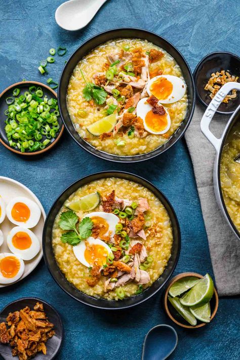 Arroz Caldo finished in bowls with toppings Filipino Arroz Caldo, Filipino Arroz Caldo Recipes, Arozcaldo Recipe Filipino Food, Arroz Caldo Filipino Recipe, Arroz Caldo Recipe, Caldo Recipe, Filipino Rice, Garlic Chips, Crispy Garlic