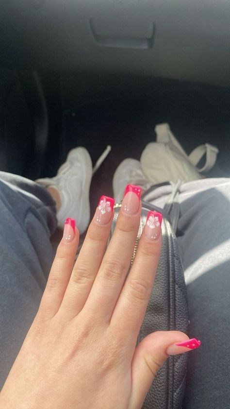 Pink French Tip With Hawaii Flower, French Tip Acrylic Nails Flower Design, Square French Tip Acrylic Nails With Flowers, Hawaii Nails Ideas Square, Nails With A Flower On One Nail, White French Tips With Hibiscus, Summer Nails Flower French Tip, Hot Pink Hawaii Nails, Nails With Hibiscus Flower Design