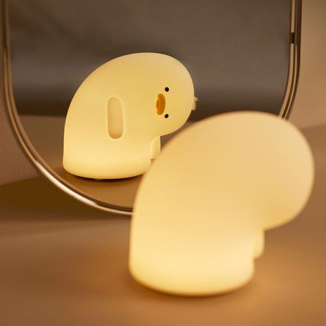 Your perfect night light for kawaii or pastel korean aesthetic room. This silicone rubber melancholy sad duck lamp will bring a touch of cuteness to your desk or bedside table. Best to use as a night light and phone stand. Warm white light, adjustable brightness, automatic 30 minutes sleep timer; Package includes: 1x Night Light Lamp, 1x USB type-c charge cable Dimmable Warm White light 1200 mAh USB Rechargeable Battery works for 4-6 hours 30' Sleep timer Type-C Charging Port (Fully charged for Raccoon Lamp, Pastel Korean Aesthetic, Korean Aesthetic Room, Night Lights Aesthetic, Kawaii Lamp, Cute Lamps, Duck Lamp, Silicone Lamp, Cute Night Lights