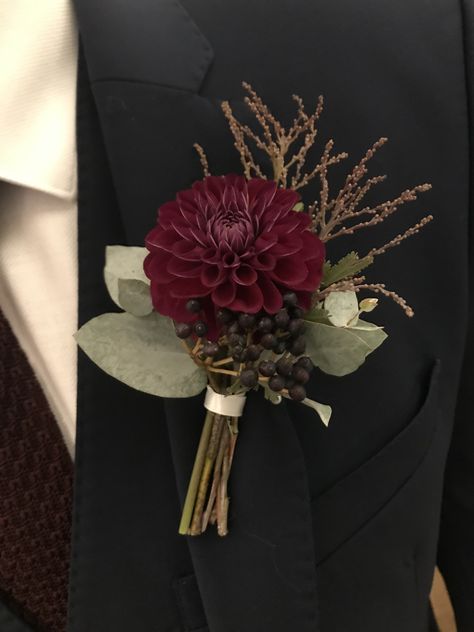 Dark Floral Boutonniere, Burgundy Ceremony Flowers, Burgundy And Gold Boutonniere, Burgundy Carnation Boutonniere, Burgundy Corsage Wedding, Dark Wedding Boutonniere, Burgandy Boutinere Ideas Groomsmen, Dark Red Boutonniere, Dahlia Boutonniere Wedding